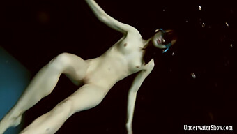 Vera Brass, A Sizzling European Teen, Strips And Poses Enticingly Underwater.