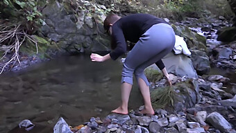 College Coed Dives Into River In Freezing Winter Weather And Shivers